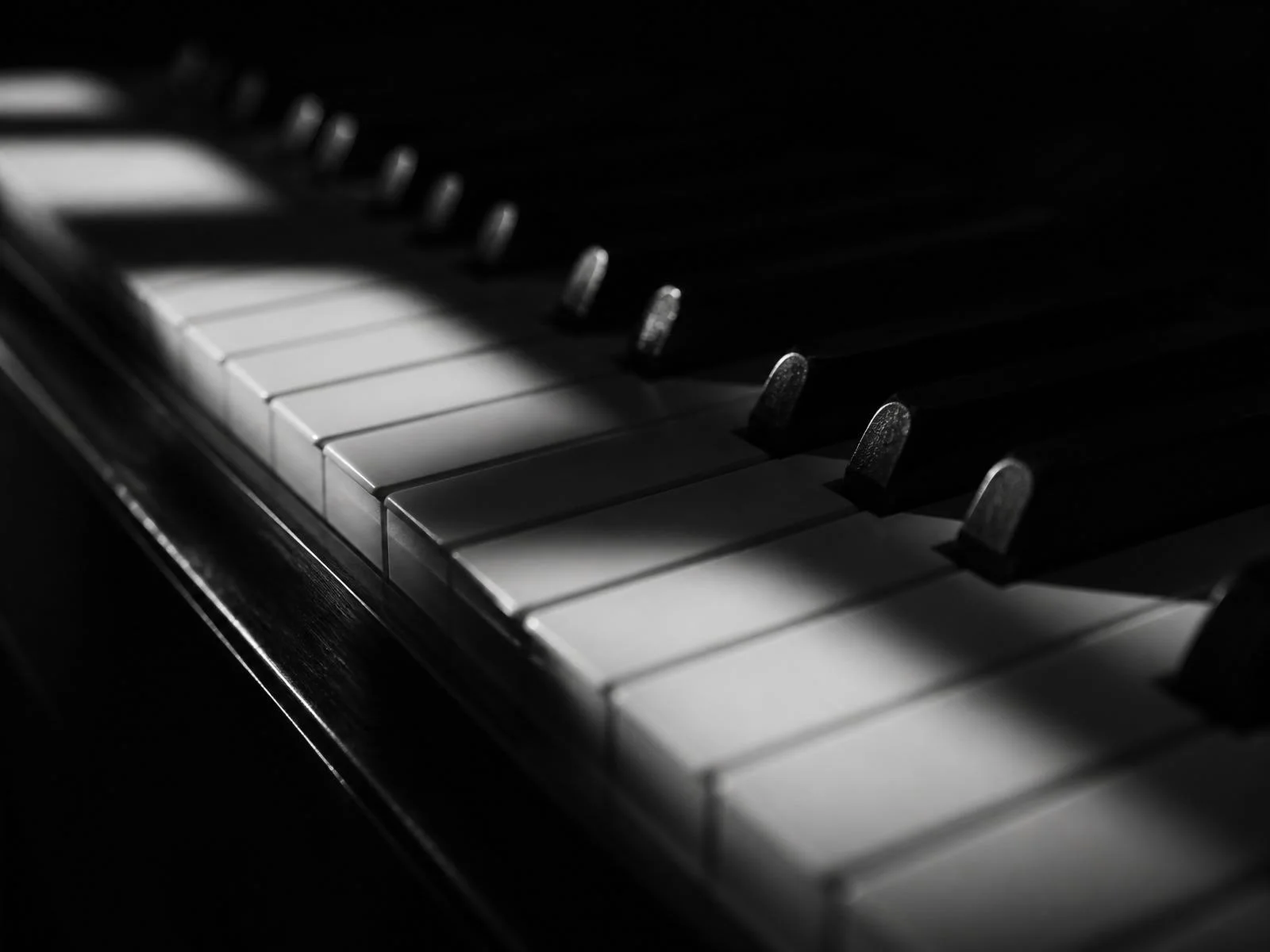 Piano keys in dramatic lighting